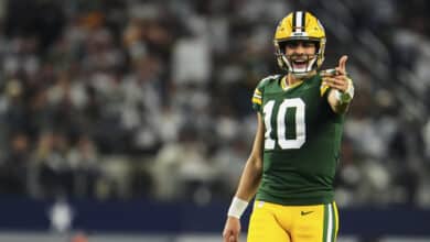 Jordan Love #10 of the Green Bay Packers reacts after a play against the Dallas Cowboys during the second half of the NFC Wild Card playoff game at AT&T Stadium on January 14, 2024 in Dallas, Texas.