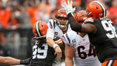 CLEVELAND, OH - SEPTEMBER 10: Cincinnati Bengals quarterback Joe Burrow (9) is hit by Cleveland Browns defensive end Za'Darius Smith (99) after throwing a pass during the third quarter of the National Football League game between the Cincinnati Bengals and Cleveland Browns on September 10, 2023, at Cleveland Browns Stadium in Cleveland, OH.