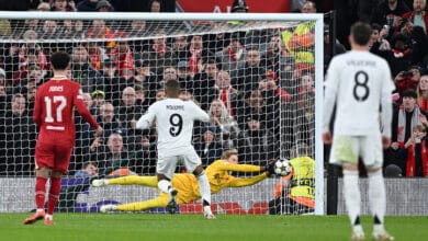 Caoimhin Kelleher of Liverpool saves a penalty from Kylian Mbappe of Real Madrid during the UEFA Champions League 2024/25 League Phase MD5 match between Liverpool FC and Real Madrid C.F. at Anfield on November 27, 2024 in Liverpool, England.