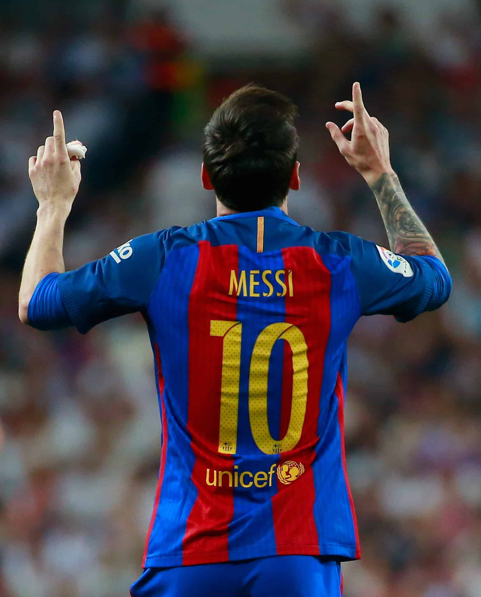 MADRID, SPAIN - APRIL 23: Lionel Messi of Barcelona (10) celebrates as he scores their first and equalising goal with team mates during the La Liga match between Real Madrid CF and FC Barcelona at Estadio Bernabeu on April 23, 2017 in Madrid, Spain.