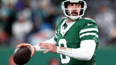 Aaron Rodgers #8 of the New York Jets in action against the Miami Dolphins at MetLife Stadium