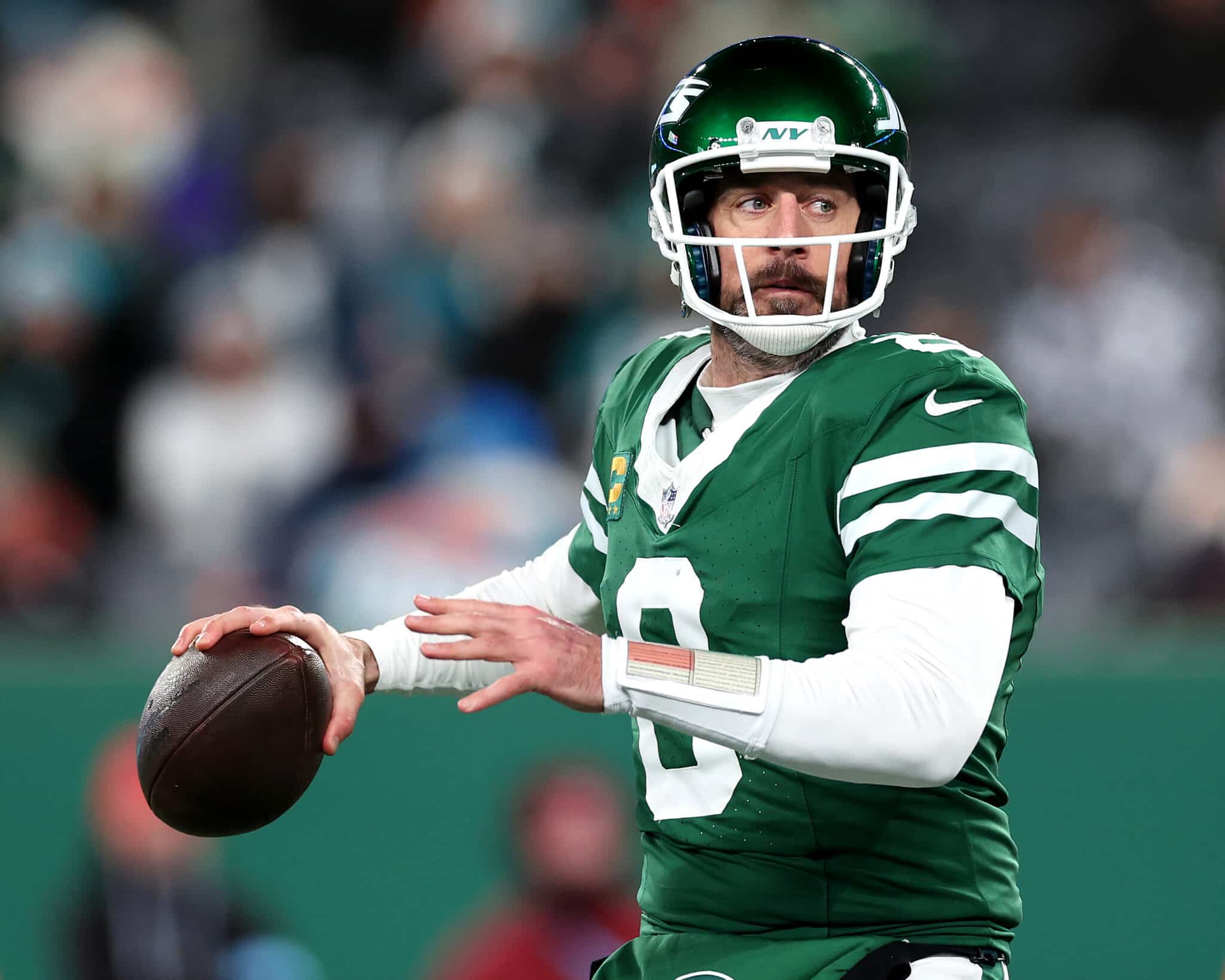Aaron Rodgers #8 of the New York Jets in action against the Miami Dolphins at MetLife Stadium