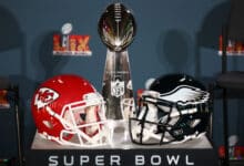 NEW ORLEANS, LOUISIANA - FEBRUARY 03: A Kansas City Chiefs helmet, the Vince Lombardi Trophy and a Philadelphia Eagles helmet are seen before the NFL Commissioner Roger Goodell's Super Bowl Press Conference ahead of Super Bowl LIX