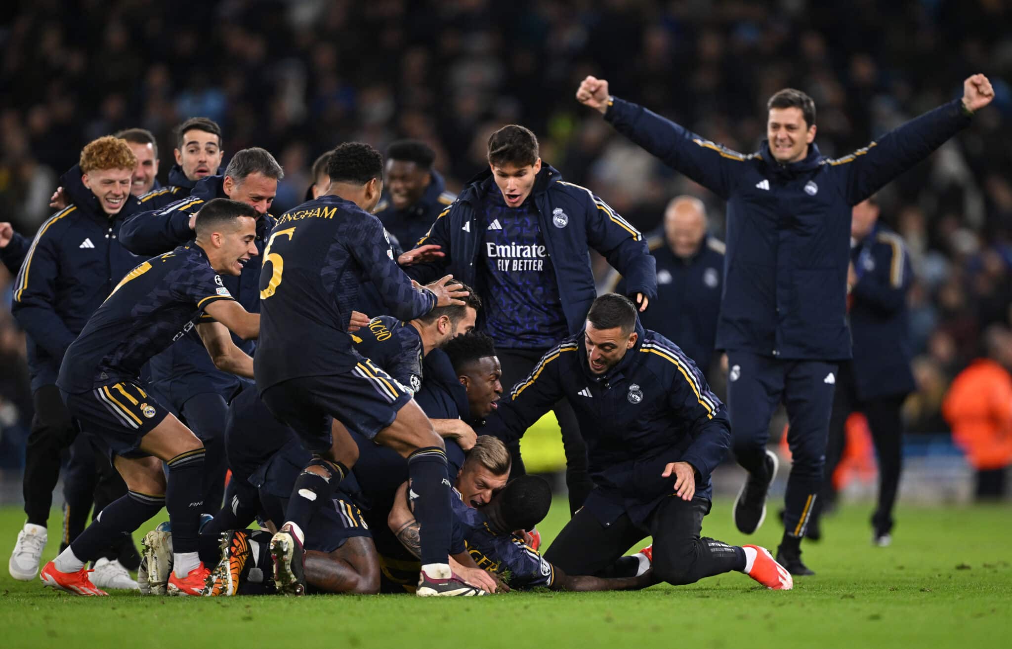 MANCHESTER, ENGLAND - APRIL 17: Antonio Ruediger celebrates with teammates Toni Kroos and Vinicius Junior of Real Madrid after scoring the sides winning penalty in the penalty shoot out during the UEFA Champions League quarter-final second leg match between Manchester City and Real Madrid CF at Etihad Stadium on April 17, 2024 in Manchester, England.