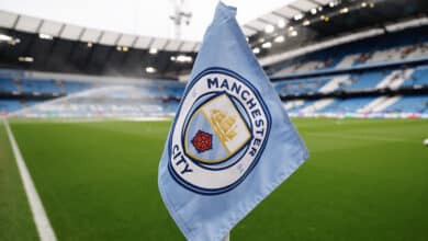 Manchester City logo on a corner flag inside the Ethiad Stadium