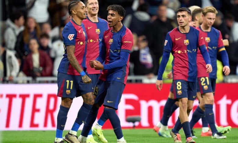 Raphinha of FC Barcelona celebrates scoring his team's fourth goal with teammates Robert Lewandowski and Lamine Yamal during the LaLiga match