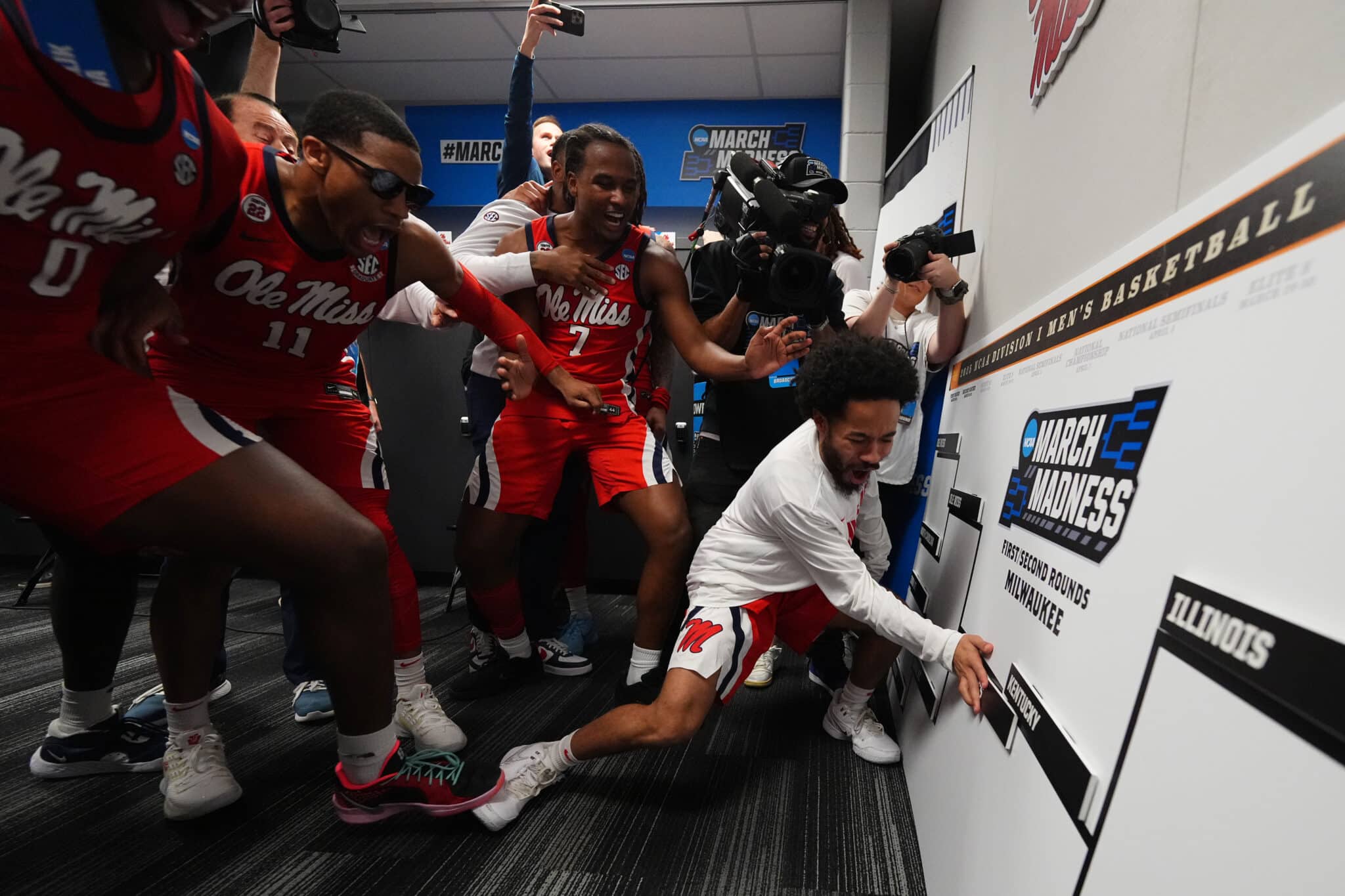 MILWAUKEE, WISCONSIN - MARCH 23: Cam Brent #55 of the Mississippi Rebels celebrates with teammates in the locker room after defeating the Iowa State Cyclones during the second round of the 2025 NCAA Men's Basketball Tournament held at Fiserv Forum on March 23, 2025 in Milwaukee, Wisconsin.