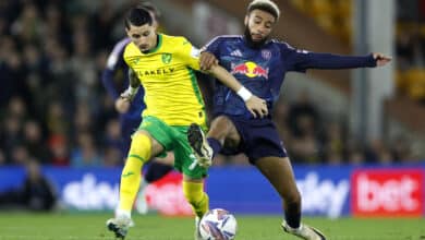 Norwich City's Borja Sainz (right) and Leeds United's Jayden Bogle battle for the ball during the Sky Bet Championship match at Carrow Road, Norwich. Picture date: Tuesday October 1, 2024.