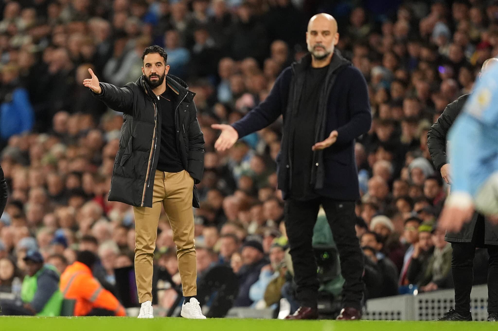 Manchester United manager Ruben Amorim (left) and Manchester City manager Pep Guardiola gesture on the touchline during the Premier League match at the Etihad Stadium, Manchester.