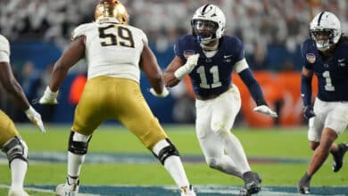 MIAMI GARDENS, FL - JANUARY 09: Penn State Nittany Lions defensive end Abdul Carter (11) rushes the passer during the Penn State Nittany Lions versus Notre Dame Fighting Irish College Football Playoff Semifinal at the Capital One Orange Bowl on January 9, 2025, at Hard Rock Stadium in Miami Gardens, FL.