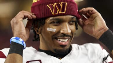 TAMPA, FLORIDA - JANUARY 12: Jayden Daniels #5 of the Washington Commanders smiles after an NFL football wild card playoff game against the Tampa Bay Buccaneers at Raymond James Stadium on January 12, 2025 in Tampa, Florida.