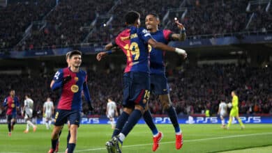 Raphinha of FC Barcelona celebrates scoring his team's first goal with teammate Lamine Yamal during the UEFA Champions League 2024/25 UEFA Champions League 2024/25 Round of 16 Second Leg match between FC Barcelona and SL Benfica at Estadi Olímpic Lluís Companys on March 11, 2025 in Barcelona, Spain.