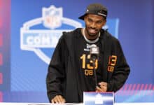 INDIANAPOLIS, INDIANA - FEBRUARY 28: Shedeur Sanders #QB13 of Colorado speaks at the podium during the 2025 NFL Combine at the Indiana Convention Center on February 28, 2025 in Indianapolis, Indiana.
