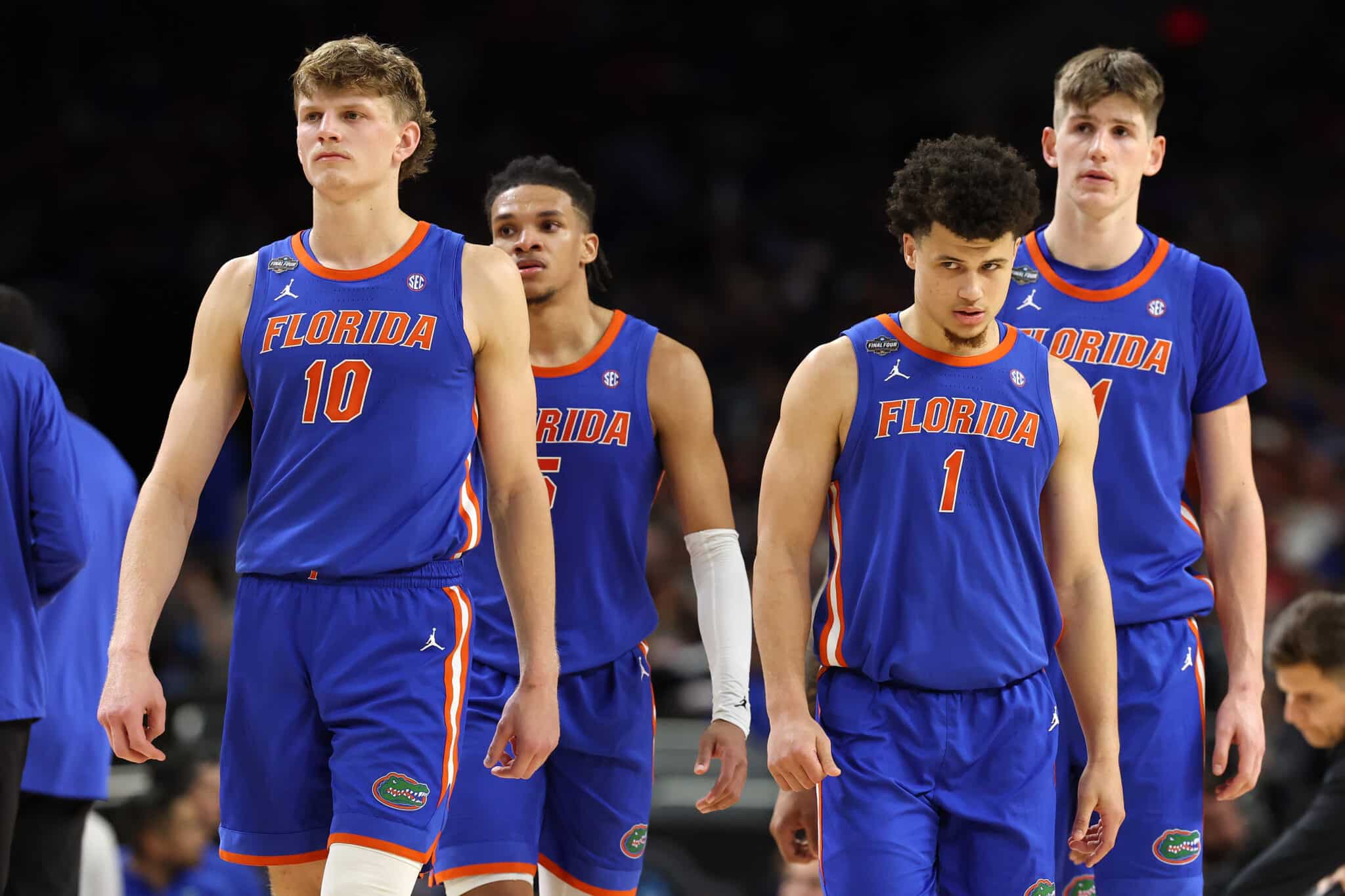 SAN ANTONIO, TEXAS - APRIL 05: Thomas Haugh #10, Will Richard #5 and Walter Clayton Jr. #1 of the Florida Gators react against the Auburn Tigers during the second half in the Final Four game of the NCAA Men's Basketball Tournament at the Alamodome on April 05, 2025 in San Antonio, Texas.