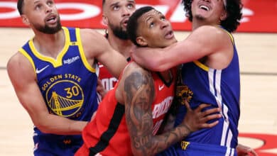 Golden State Warriors' Gui Santos and Houston Rockets'Jabari Smith, Jr. vie for rebound position in 2nd quarter during Game 1 of First Round of NBA Playoffs at Toyota Center in Houston, Texas on Sunday, April 20, 2025.