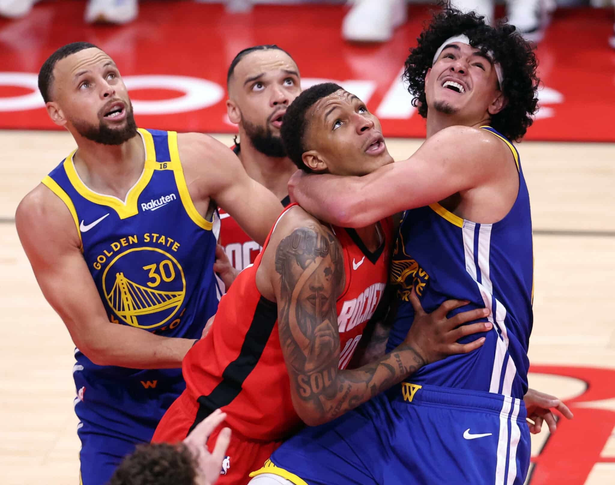 Golden State Warriors' Gui Santos and Houston Rockets'Jabari Smith, Jr. vie for rebound position in 2nd quarter during Game 1 of First Round of NBA Playoffs at Toyota Center in Houston, Texas on Sunday, April 20, 2025.