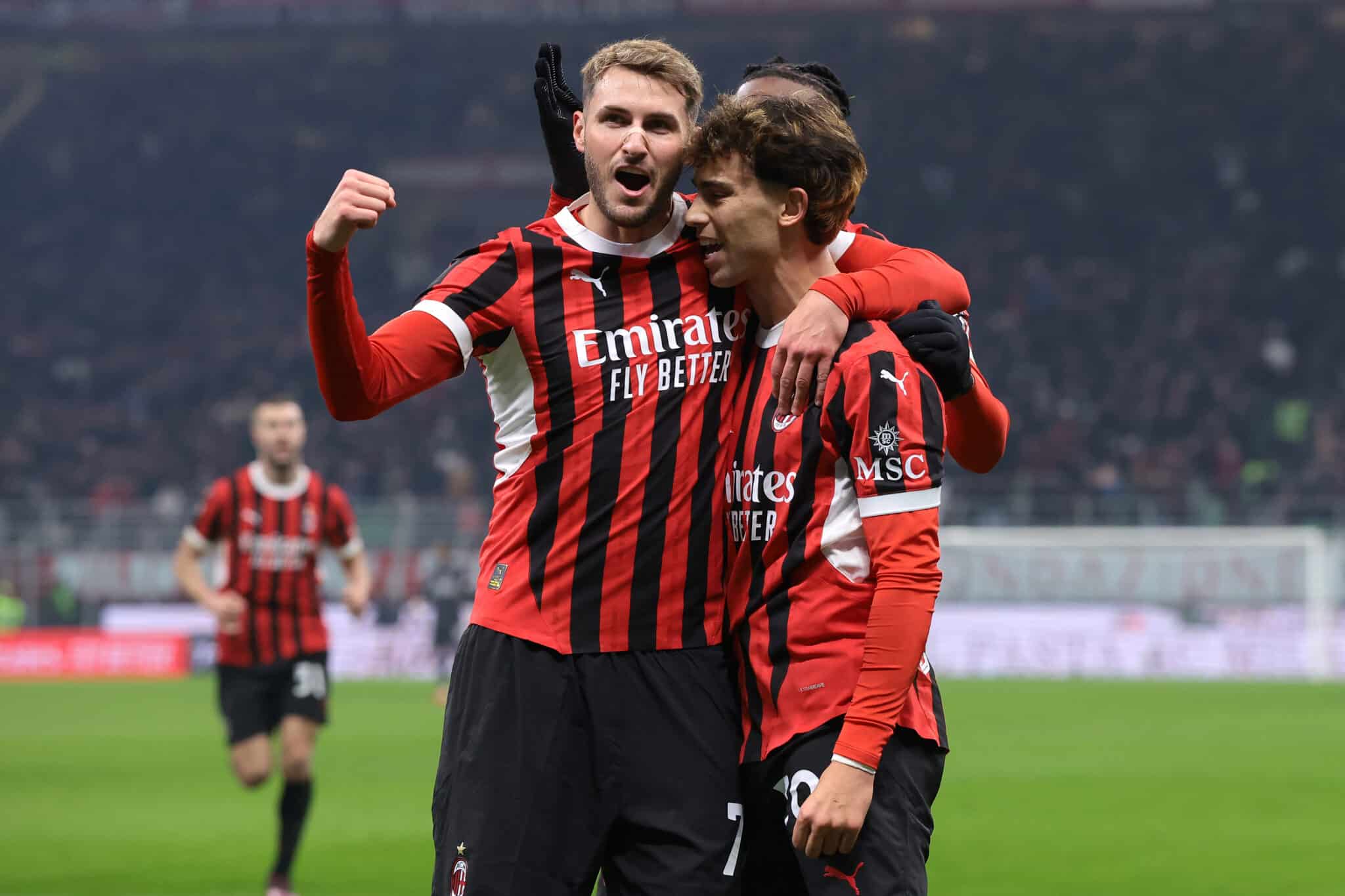 Joao Felix of AC Milan celebrates with team mates Santiago Gimenez and Rafael Leao after scoring during the Coppa Italia Quarter Final match