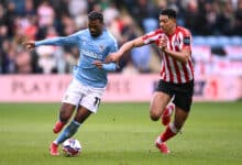 Haji Wright of Coventry City holds off the challenge of Jobe Bellingham of Sunderland