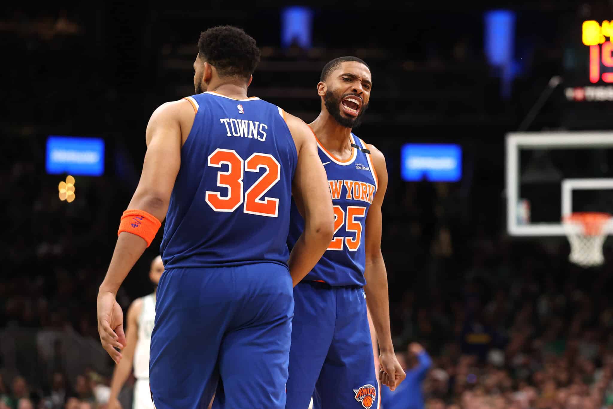 Mikal Bridges #25 of the New York Knicks celebrates with Karl-Anthony Towns #32 during the second half against the Boston Celtics