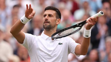 Novak Djokovic of Serbia celebrates winning match point with a violin gesture against Lorenzo Musett