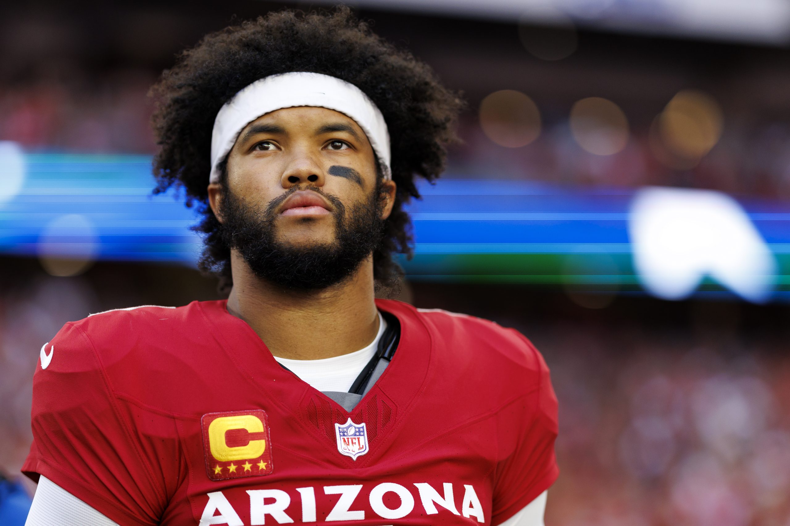 GLENDALE, ARIZONA - JANUARY 5: Quarterback Kyler Murray #1 of the Arizona Cardinals stands on the sidelines during the national anthem prior to an NFL football game against the San Francisco 49ers at State Farm Stadium on January 5, 2025 in Glendale, Arizona.