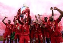 Virgil van Dijk of Liverpool, lifts the Premier League trophy