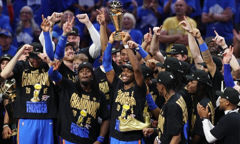 OKLAHOMA CITY, OKLAHOMA - JUNE 22: Shai Gilgeous-Alexander #2 of the Oklahoma City Thunder celebrates with the Bill Russell NBA Finals Most Valuable Player trophy after defeating the Indiana Pacers 103-91 in Game Seven of the 2025 NBA Finals at Paycom Center on June 22, 2025 in Oklahoma City, Oklahoma. NOTE TO USER: User expressly acknowledges and agrees that, by downloading and or using this photograph, User is consenting to the terms and conditions of the Getty Images License Agreement.