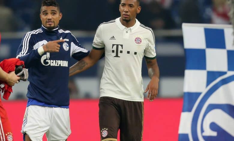 Jerome Boateng of Munich (R) hugs his brother Kevin-Prince Boateng of Schalke after the Bundesliga match between FC Schalke 04 and FC Bayern Muenchen