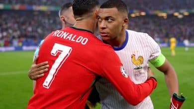 Kylian Mbappe of France embraces Cristiano Ronaldo of Portugal