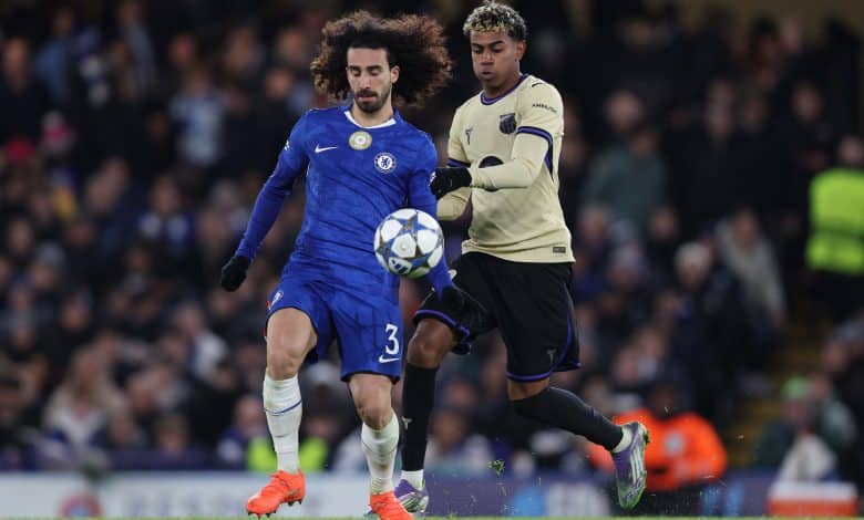 Marc Cucurella of Chelsea battles for the ball with Lamine Yamal of Barcelona