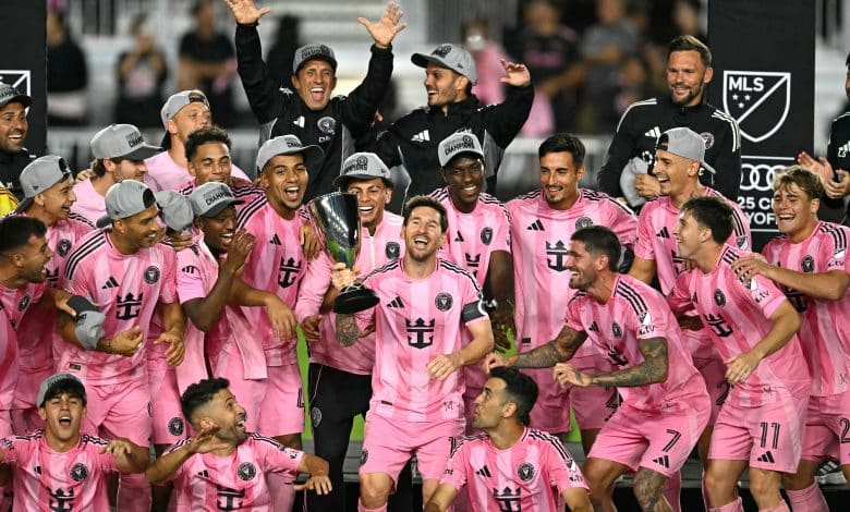 Inter Miami's Argentine forward #10 Lionel Messi (C) celebrates with the trophy after his team's victory in the Major League Soccer (MLS) Eastern Conference final football match between Inter Miami and New York City FC at Chase Stadium in Fort Lauderdale, Florida on November 29, 2025. Lionel Messi and Inter Miami reached the MLS Cup final for the first time on November 29, 2025 after a 5-1 thrashing of New York City FC in the Eastern Conference playoffs.