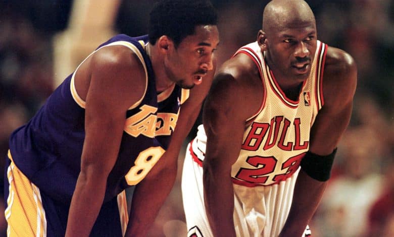 CHICAGO, UNITED STATES: Los Angeles Lakers guard Kobe Bryant(L) and Chicago Bulls guard Michael Jordan(R) talk during a free-throw attempt during the fourth quarter 17 December at the United Center in Chicago. Bryant, who is 19 and bypassed college basketball to play in the NBA, scored a team-high 33 points off the bench, and Jordan scored a team-high 36 points. The Bulls defeated the Lakers 104-83. AFP PHOTO VINCENT LAFORET