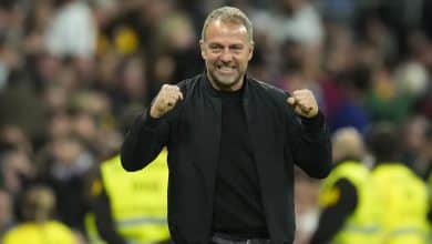 Hansi Flick head coach of Barcelona celebrates the goal of his team during the La Liga match between Real Madrid CF and FC Barcelona at Estadio Santiago Bernabeu on October 27, 2024 in Madrid, Spain.