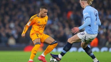MANCHESTER, ENGLAND - FEBRUARY 11: Kylian Mbappe of Real Madrid is challenged by Erling Haland of Manchester City during the UEFA Champions League 2024/25 League Knockout Play-off first leg match between Manchester City and Real Madrid C.F. at Manchester City Stadium on February 11, 2025 in Manchester, England.