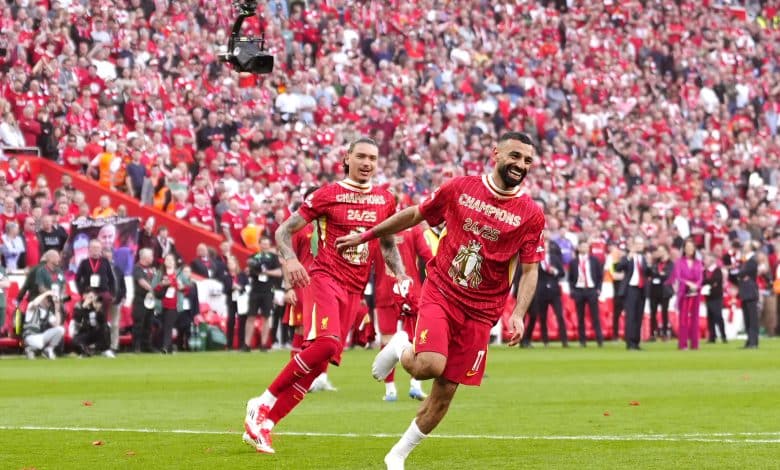 Liverpool's Mohamed Salah (right) and team-mates celebrate victory and the Premier League title following the Premier League match at Anfield, Liverpool. Picture date: Sunday April 27, 2025.