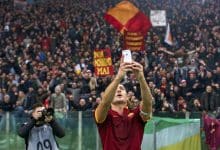 Francesco Totti of AS Roma selfie Apple iPhone during the Serie A match between AS Roma and Lazio Roma on January 11,2014 at the Stadio Olimpico in Rome, Italy.