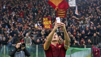 Francesco Totti of AS Roma selfie Apple iPhone during the Serie A match between AS Roma and Lazio Roma on January 11,2014 at the Stadio Olimpico in Rome, Italy.