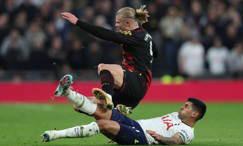 Tottenham Hotspur's Argentinian defender Cristian Romero (R) commits a foul on Manchester City's Norwegian striker Erling Haaland (L) and received a yellow card during the English Premier League football match between Tottenham Hotspur and Manchester City at Tottenham Hotspur Stadium in London, on February 5, 2023. - - RESTRICTED TO EDITORIAL USE. No use with unauthorized audio, video, data, fixture lists, club/league logos or 'live' services. Online in-match use limited to 120 images. An additional 40 images may be used in extra time. No video emulation. Social media in-match use limited to 120 images. An additional 40 images may be used in extra time. No use in betting publications, games or single club/league/player publications. (Photo by Adrian DENNIS / AFP) / RESTRICTED TO EDITORIAL USE. No use with unauthorized audio, video, data, fixture lists, club/league logos or 'live' services. Online in-match use limited to 120 images. An additional 40 images may be used in extra time. No video emulation. Social media in-match use limited to 120 images. An additional 40 images may be used in extra time. No use in betting publications, games or single club/league/player publications. / RESTRICTED TO EDITORIAL USE. No use with unauthorized audio, video, data, fixture lists, club/league logos or 'live' services. Online in-match use limited to 120 images. An additional 40 images may be used in extra time. No video emulation. Social media in-match use limited to 120 images. An additional 40 images may be used in extra time. No use in betting publications, games or single club/league/player publications.