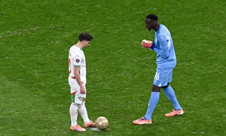 AFCON is mental - Senegal's goalkeeper #16 Edouard Mendy speaks to Morocco's forward #10 Brahim Diaz before a penalty kick during the Africa Cup of Nations (CAN) final football match between Senegal and Morocco at the Prince Moulay Abdellah Stadium in Rabat on January 18, 2026.