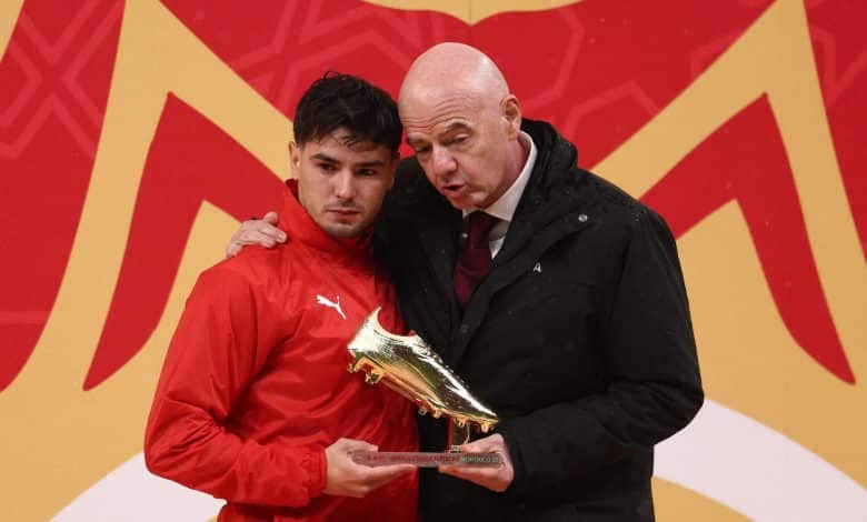 Morocco's forward #10 Brahim Diaz receives the Golden Boot from FIFA President Gianni Infantino during presentation at the end of the Africa Cup of Nations (CAN) final football match between Senegal and Morocco at the Prince Moulay Abdellah Stadium in Rabat on January 18, 2026.