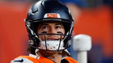 DENVER, CO - DECEMBER 21: Jarrett Stidham #8 of the Denver Broncos looks on from the bench during the fourth quarter against the Jacksonville Jaguars at Empower Field at Mile High on December 21, 2025 in Denver, Colorado.