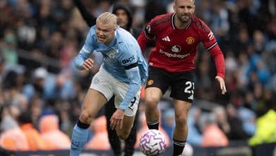 MANCHESTER, ENGLAND - SEPTEMBER 14: Luke Shaw of Manchester United attempts to stop Erling Braut Haaland of Manchester City during the Premier League match between Manchester City and Manchester United at Etihad Stadium on September 14, 2025 in Manchester, England.