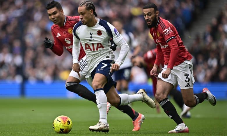 LONDON, ENGLAND - NOVEMBER 8: Xavi Simons of Tottenham Hotspurs and Noussair Mazraoui of Manchester United F.C. battle for a ball during the Premier League match between Tottenham Hotspur and Manchester United at Tottenham Hotspur Stadium on November 8, 2025 in London, England.